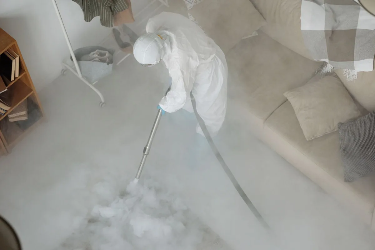 Biohazard cleanup technician in protective equipment, Watkins Glen, NY